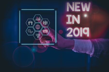 Writing note showing New In 2019. Business concept for what will be expecting or new creation for the year 2019 Picture photo network scheme with modern smart deviceの写真素材