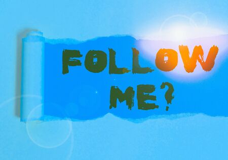 Word writing text Follow Me Question. Business photo showcasing go or come after demonstrating or thing proceeding ahead Cardboard which is torn in the middle placed above a plain table backdropの写真素材