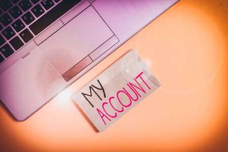 Word writing text My Account. Business photo showcasing If something is said to be on someone s is or something s is account Slim trendy silver open laptop square sticky notepad colored backgroundの写真素材