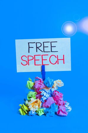 Word writing text Free Speech. Business photo showcasing the right of showing to express their opinions publicly Reminder pile colored crumpled paper clothespin reminder blue backgroundの写真素材
