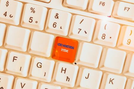 Text sign showing Video Monitoring Systems. Business photo showcasing Surveillance Transmit capture Image to Digital Link White pc keyboard with empty note paper above white background key copy spaceの写真素材