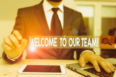 Text sign showing Welcome To Our Team. Business photo text introducing another demonstrating to your team mates Male human wear formal clothes present presentation use hi tech smartphoneの写真素材