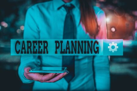 Conceptual hand writing showing Career Planning. Concept meaning Strategically plan your career goals and work success Business woman in shirt holding laptop and mobile phoneの写真素材
