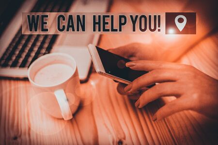 Word writing text We Can Help You. Business photo showcasing offering good assistance to customers or friends woman laptop computer smartphone mug office supplies technological devicesの写真素材