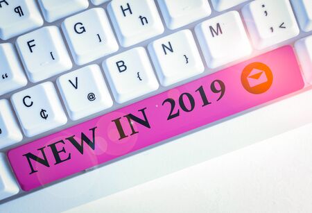 Text sign showing New In 2019. Business photo showcasing what will be expecting or new creation for the year 2019 White pc keyboard with empty note paper above white background key copy spaceの写真素材