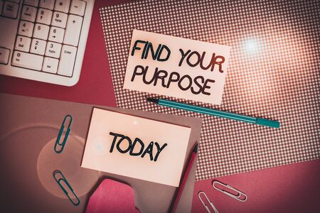 Word writing text Find Your Purpose question. Business photo showcasing reason for something is done or for which exists Writing equipments and computer stuffs placed above colored plain tableの写真素材