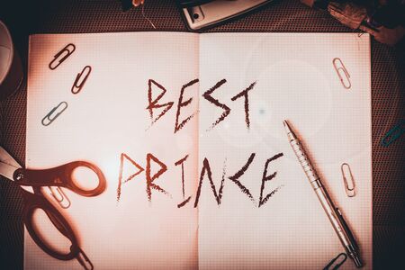 Text sign showing Best Prince. Business photo text the male royal ruler of a small country Son of the king or queen Scissors and writing equipments plus math book above textured backdropの写真素材