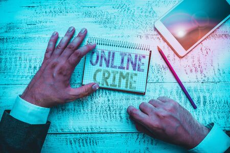 Conceptual hand writing showing Online Crime. Concept meaning crime or illegal online activity committed on the Internetの写真素材