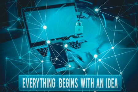 Conceptual hand writing showing Everything Begins With An Idea. Concept meaning steps you take to turn an idea into a reality Picture photo network scheme with modern smart deviceの写真素材