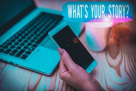 Text sign showing What S Your Story Question. Business photo showcasing asking demonstrating about his past life actions career or events woman laptop computer smartphone mug office supplies technological devicesの写真素材