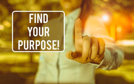 Handwriting text writing Find Your Purpose. Conceptual photo reason for something is done or for which still exists Woman in a blue business shirts pointing with her finger into empty spaceの写真素材