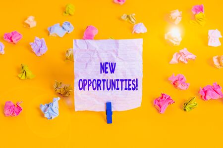 Writing note showing New Opportunities. Business concept for exchange views condition favorable for attainment goal Colored crumpled paper empty reminder white floor clothespinの写真素材