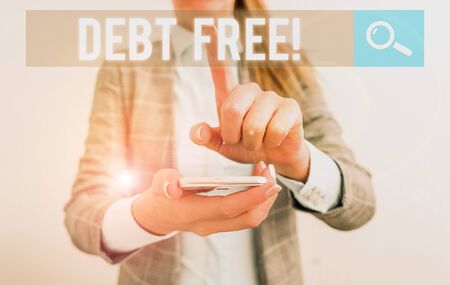 Conceptual hand writing showing Debt Free. Concept meaning does not owning any money to any individual or companies Business concept with mobile phone and business womanの写真素材