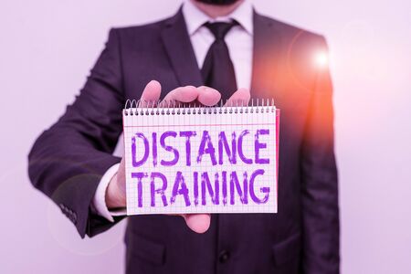 Handwriting text writing Distance Training. Conceptual photo learning remotely without being present at school Male human wear formal work suit office look hold mathematics book use handの写真素材
