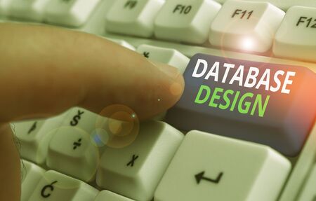 Writing note showing Database Design. Business concept for organisation of data according to a database modelの写真素材