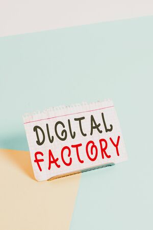 Text sign showing Digital Factory. Business photo text uses digital technology to operate the manufacturing process Paper placed tilted above buffer wire on soft pastel multi colours backdropの写真素材