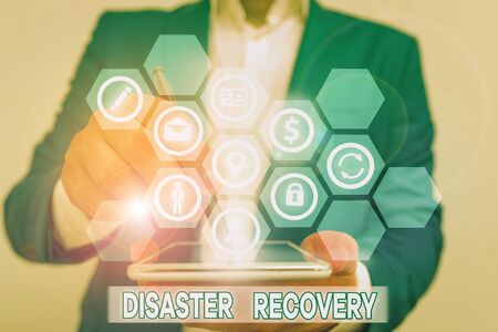 Conceptual hand writing showing Disaster Recovery. Concept meaning helping showing affected by a serious damaging eventの写真素材