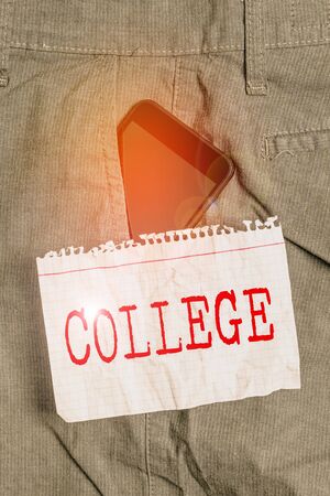 Word writing text College. Business photo showcasing educational institution or establishment providing higher education Smartphone device inside formal work trousers front pocket near note paperの写真素材