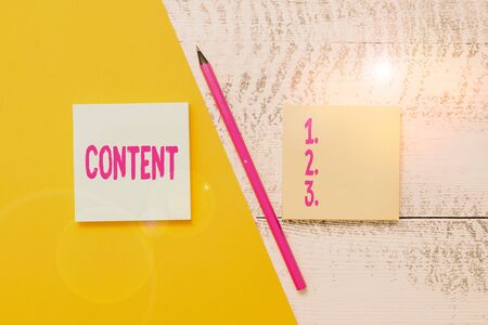 Conceptual hand writing showing Content. Concept meaning Things included in something Marketing material State of happiness Blank notepads pen colored paper sheet wooden backgroundの写真素材