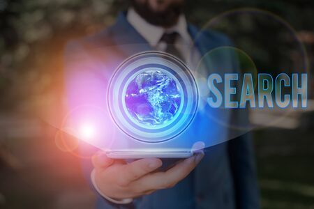 Conceptual hand writing showing Search. Concept meaning try to find something by looking or otherwise seeking carefullyの写真素材