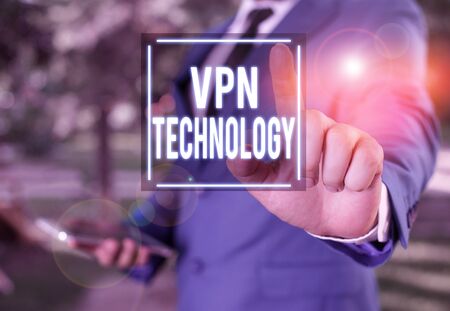 Handwriting text writing Vpn Technology. Conceptual photo programming that creates a safe and encrypted connection Businessman with pointing finger in front of himの写真素材