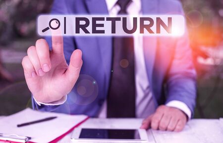 Handwriting text Return. Conceptual photo come or go back to a place or demonstrating Give money you took before Businessman with pointing finger in front of himの写真素材