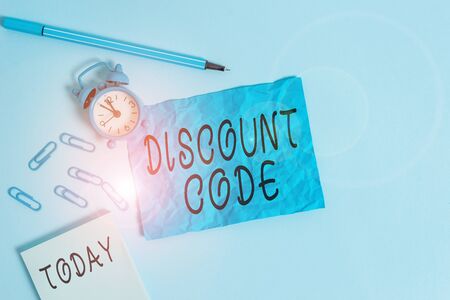 Handwriting text writing Discount Code. Conceptual photo Series of letters or numbers that allow you to get a discount Alarm clock clips notepad blank crushed sheet marker sky colored backgroundの写真素材