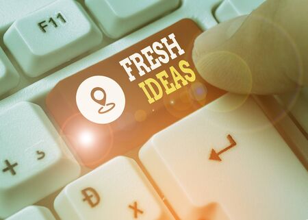 Writing note showing Fresh Ideas. Business concept for the thought or suggestion as to possible...
