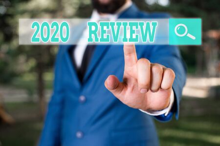 Conceptual hand writing showing 2020 Review. Concept meaning remembering past year events main...