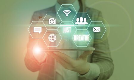 Writing note showing Just Breathe. Business concept for Take a break in a stressful day To overcome...