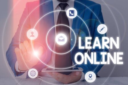 Word writing text Learn Online. Business photo showcasing education that takes place over the Internet or computerの写真素材