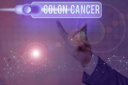 Conceptual hand writing showing Colon Cancer. Concept meaning the development of cancer cells from the colon or rectumの写真素材