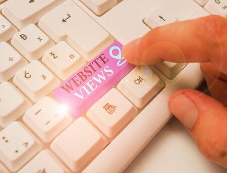 Writing note showing Website Views. Business concept for Number of visitors a website receives in a given time periodの写真素材