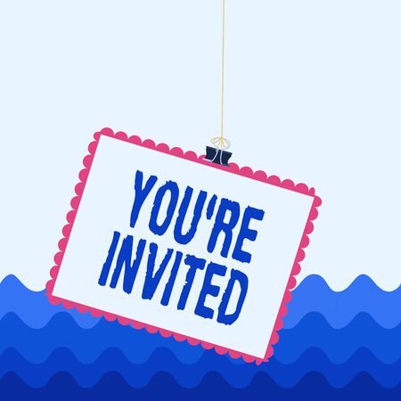 Conceptual hand writing showing You Re Invited. Concept meaning make a polite friendly request to someone go somewhere Stamp stuck binder clip square color frame rounded tipの写真素材