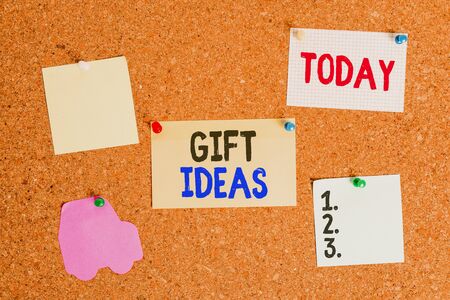 Conceptual hand writing showing Gift Ideas. Concept meaning a thought or suggestion for giving a present to someone Corkboard size paper thumbtack sheet billboard notice boardの写真素材