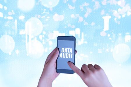 Conceptual hand writing showing Data Audit. Concept meaning auditing of data to assess its quality for a specific purposeの写真素材