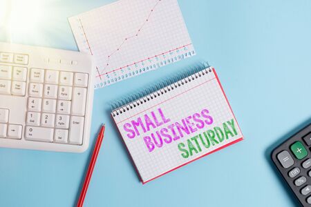 Text sign showing Small Business Saturday. Business photo text American shopping holiday held during the Saturday Paper blue desk computer keyboard office study notebook chart numbers memoの写真素材