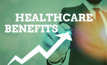 Writing note showing Healthcare Benefits. Business concept for monthly fair market valueprovided to Employee dependentsの写真素材