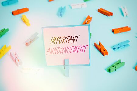 Word writing text Important Announcement. Business photo showcasing spoken statement that tells showing about something Colored clothespin papers empty reminder blue floor background office pinの写真素材