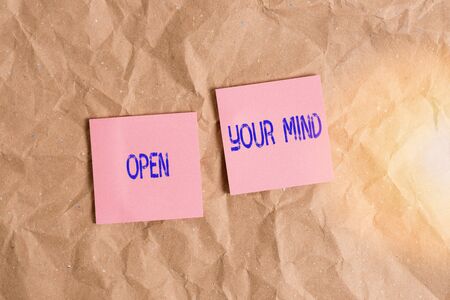 Writing note showing Open Your Mind. Business concept for to be able to understand different ideas or ways of thinking Papercraft desk square spiral notebook office study suppliesの写真素材