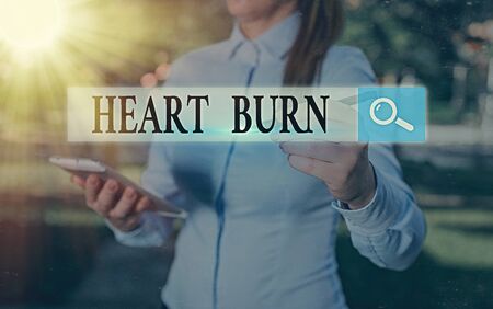 Conceptual hand writing showing Heart Burn. Concept meaning a burning sensation or pain in the throat from acid refluxの写真素材
