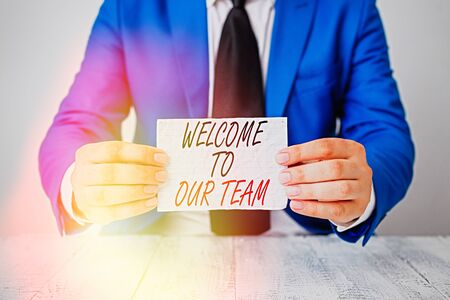 Conceptual hand writing showing Welcome To Our Team. Concept meaning introducing another demonstrating to your team mates Man holds empty paper with copy space in front of him Spaceの写真素材