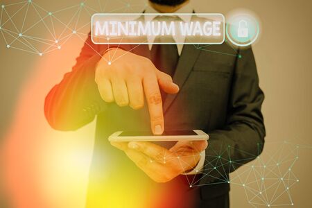 Conceptual hand writing showing Minimum Wage. Concept meaning the lowest wage permitted by law or by a special agreementの写真素材