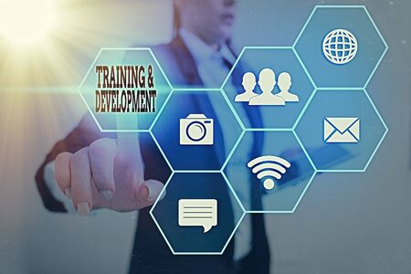 Writing note showing Training And Development. Business concept for learn specific knowledge to improve performanceの写真素材