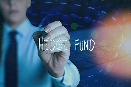 Writing note showing Hedge Fund. Business concept for basically a fancy name for an alternative investment partnershipの写真素材