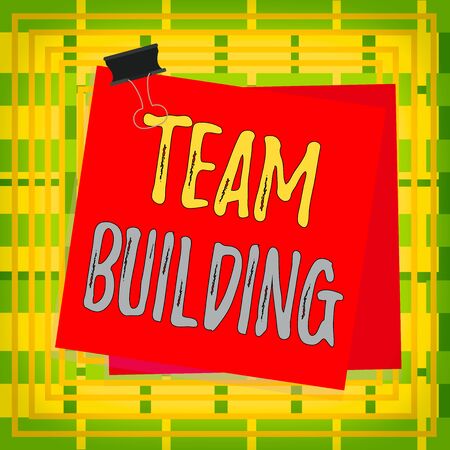 Text sign showing Team Building. Business photo showcasing various types of activities used to enhance social relations Paper stuck binder clip colorful background reminder memo office supplyの写真素材