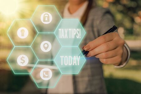 Word writing text Tax Tips. Business photo showcasing compulsory contribution to state revenue levied by governmentの写真素材