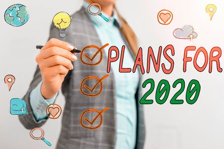 Writing note showing Plans For 2020. Business concept for an intention or decision about what one is...