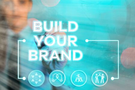 Writing note showing Build Your Brand. Business concept for enhancing brand equity using advertising campaignsの写真素材