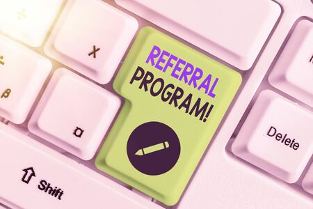 Writing note showing Referral Program. Business concept for internal recruitment method employed by organizationsの写真素材
